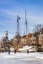 Historic wooden ship and town hall in winter in Dokkum