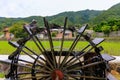 Historic wooden water wheel by rice field in Japanese countryside Royalty Free Stock Photo