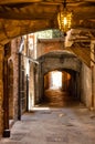 Historic Rue Obscure Dark Street underground passageway under harbor front houses in old town of Villefranche-sur-Mer in France