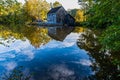 Historic Yates Grist Mill Reflecting on Yates Mill Pond Royalty Free Stock Photo