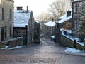 The yorkshire village of heptonstall in winter with snow covered roofs and street