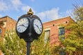 Historic Ypsilanti Street Clock with Blue Sky and Brick Building