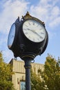 Historic Ypsilanti Street Clock with Autumn Trees and Clear Sky