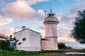 Historical Aegean lighthouse against a blue sky and clouds background Royalty Free Stock Photo