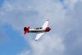 Historical airplane doing manoeuvres in the sky.