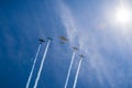 Historical airplanes flying in formation on a blue sky background, California