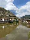 Historical Amasya houses on the banks of the KÃÂ±zÃÂ±lÃÂ±rmak River and Kralkaya  King rock tombs cemeteries on the back. Royalty Free Stock Photo