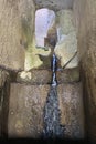 Historical ancient ruins bath temple, Bath of Cleopatra, pond filled with fresh stream water flowing down stone tunnels stairs