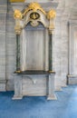 Historical arch frame niche embedded in a marble wall