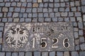 Historical bronze plaques with important dates on passway. Old town, Wroclaw. Poland