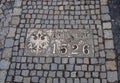 Historical bronze plaques with important dates on passway. Old town, Wroclaw. Poland