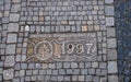 Historical bronze plaques with important dates on passway. Old town, Wroclaw. Poland