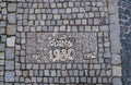 Historical bronze plaques with important dates on passway. Old town, Wroclaw. Poland