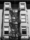 Historical building detail with fire escape stairs - Black and white Royalty Free Stock Photo