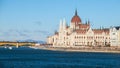 Historical building of Hungarian Parliament on Danube River Embankment in Budapest. Sunny day shot with clear blue sky. Royalty Free Stock Photo