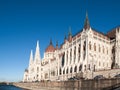 Historical building of Hungarian Parliament on Danube River Embankment in Budapest. Sunny day shot with clear blue sky. Royalty Free Stock Photo