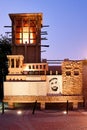 Historical building with a traditional wind tower and the poster of Zayed bin Sultan Al Nahyan in old town Dubai, UAE Royalty Free Stock Photo