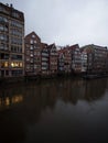 Historical buildings architecture reflection in Bleichenfleet Alster river canal in city centre of Hamburg Germany