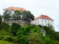 historical buildings on green hilltop