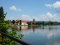 historical buildings with lake reflection