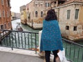 VENICE, ITALY - 2018. Woman stays at the brridge.