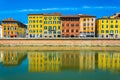 Historical buildings stretched alongside river Arno in the historical center of the italian city Pisa....IMAGE Royalty Free Stock Photo