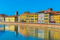 Historical buildings stretched alongside river Arno in the historical center of the italian city Pisa....IMAGE Royalty Free Stock Photo