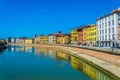 Historical buildings stretched alongside river Arno in the historical center of the italian city Pisa....IMAGE Royalty Free Stock Photo