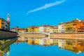 Historical buildings stretched alongside river Arno in the historical center of the italian city Pisa....IMAGE Royalty Free Stock Photo