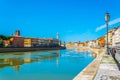 Historical buildings stretched alongside river Arno in the historical center of the italian city Pisa....IMAGE Royalty Free Stock Photo