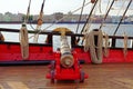 Historical cannon of an old wooden sailboat. Details deck of the ship.