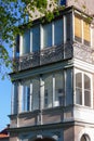 historical city facades with windows balcony doors