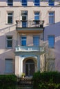 historical city facades with windows balcony doors