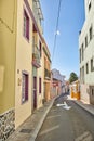 Historical city street view of residential houses in small and narrow alley or road in tropical Santa Cruz, La Palma Royalty Free Stock Photo