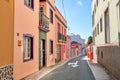 Historical city street view of residential houses in small and narrow alley or road in tropical Santa Cruz, La Palma Royalty Free Stock Photo