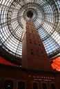 Historical Coop`s  Shot Tower, encased by the Melbourne Central 84 m-high conical glass roof. Royalty Free Stock Photo