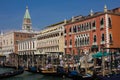 Historical Doge`s Palace with venetian gondolas floating on the canal grande