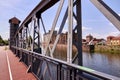 Historical drawbridge made of steel arches in front of a warehouse in the old port of Magdeburg