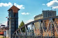Historical drawbridge made of steel arches in front of a warehouse in the old port of Magdeburg
