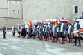 Historical dressed men against ambulance cars