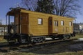 Historical Fallen flag Milwaukee Road caboose numbered 992083 sits on display near the Rochelle Train Park