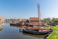 Historical fishing vessels anchored in harbor Dutch fishing village Workum