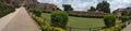 Historical Golconda fort with beautiful greenery and background of shiney white clouds