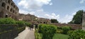 Historical Golconda fort with beautiful greenery and background of shiney white clouds