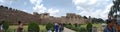 Historical Golconda fort with beautiful greenery and background of shiny white clouds