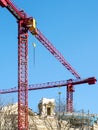 Historical house facade restoration and roof repair using scaffolding and tower crane Royalty Free Stock Photo