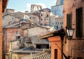 Historical houses of ancient city Siena, Tuscany. Tile roofs and brick structures in Italy. UNESCO World Heritage Site Royalty Free Stock Photo