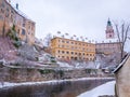 Historical houses and castle landmark statue river winter season snow in Cesky Krumlov. Czech Republic Royalty Free Stock Photo