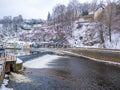 Historical houses and castle landmark statue river winter season snow in Cesky Krumlov. Czech Republic Royalty Free Stock Photo