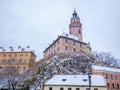 Historical houses and castle landmark statue river winter season snow in Cesky Krumlov. Czech Republic Royalty Free Stock Photo